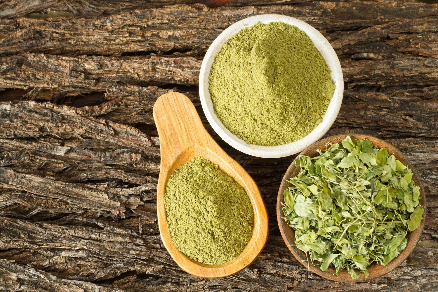 Moringa leaves and powder in containers.